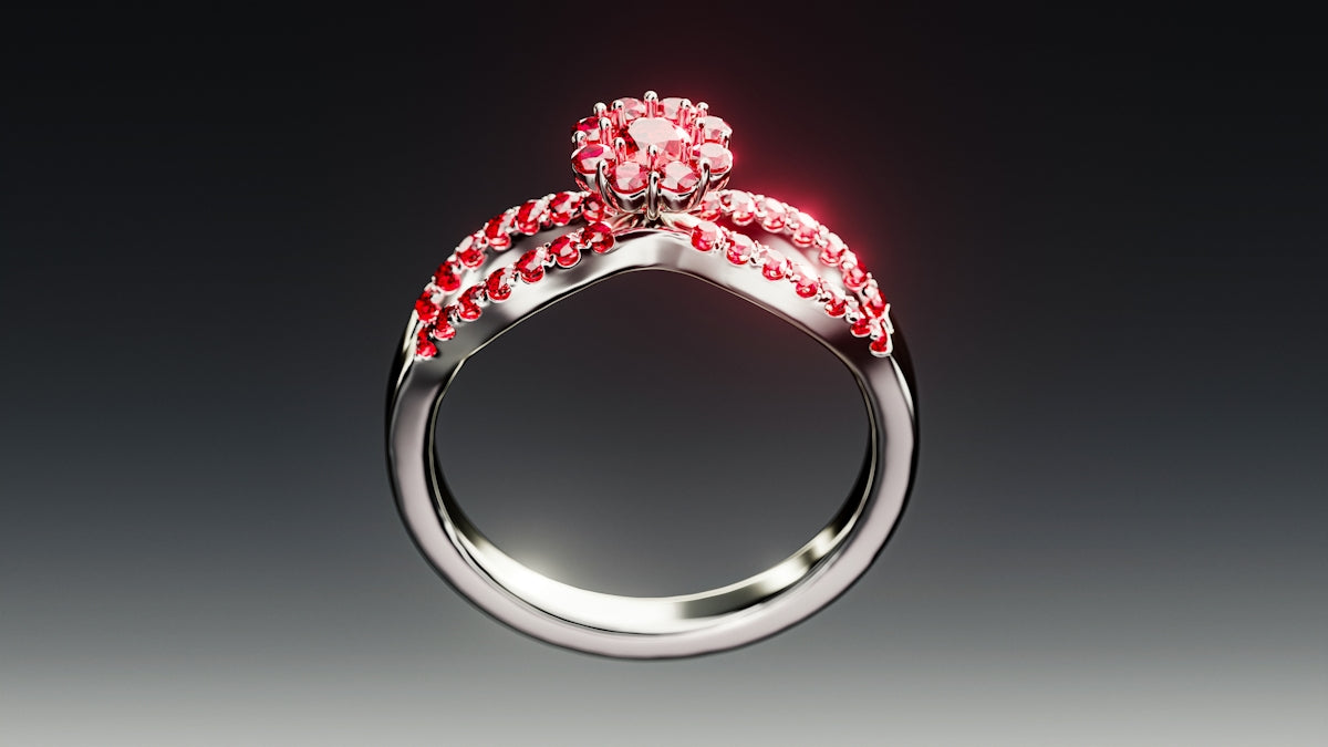 A silver ring with small pink gemstones